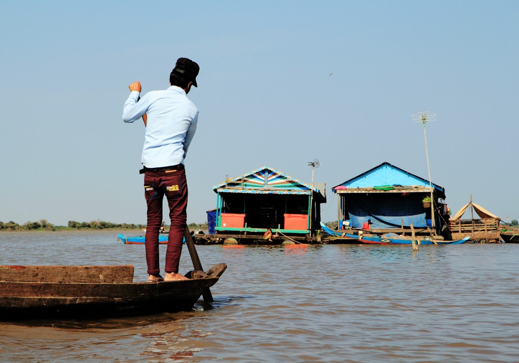 Floating village residents in Cambodia. By Faine Greenwood. 