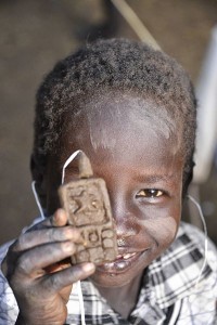 Boy with clay phone.   By Rod Waddington - Wikimedia Commons.